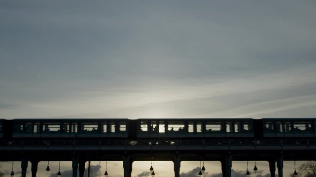 Metro passing by on Paris Bir Hakeim Bridge