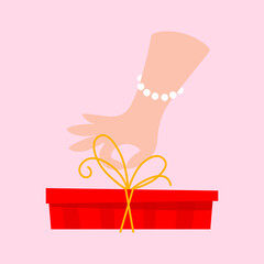 Elegant Hand Tying Ribbon on a Red Present for Mothers Day