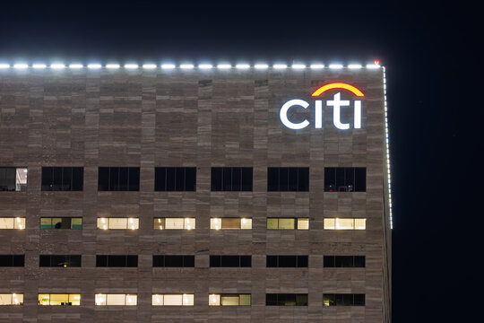 Citi bank logo glowing on modern building at night in Miami, Florida