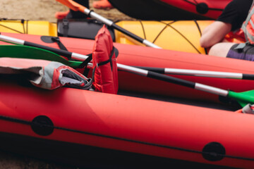 Naklejka premium Kayaking in the lake, colorful canoe kayak boat paddling, canoeing in river, scandinavian skerries landscape, group of tourists athletes in kayaks floating, kayakers rowing during water sports tour