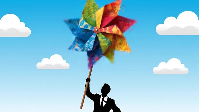 Businessman holding colorful kite flying high in blue sky with clouds success freedom leadership