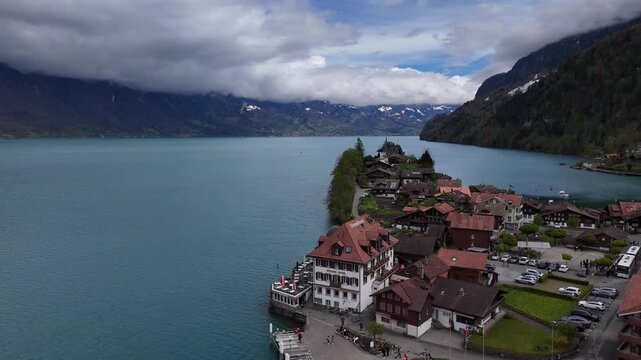 Drone shot of Iseltwald pier on turquoise Lake Brienz