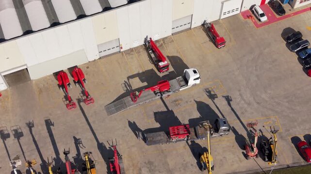 Aerial view of semi-truck maneuvering in industrial logistics center