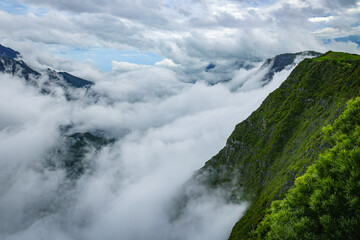 Naklejka premium Scenic cloudy landscape from Belvédère du Nez de Boeuf, Reunion Island, France 