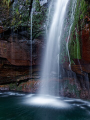 Obraz premium Waterfall 25 Springs (25 Fontes) group of different streams located in Rabaçal, Paul da Serra on Madeira Island on Levada das 25 Fontes, 30m high fall in primitive forest Laurisilva of Madeira
