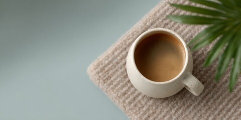 White coffee cup with a brown liquid in it