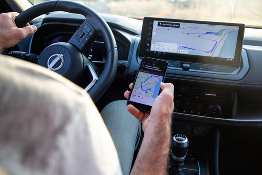 SICILY, ITALY - JUNE 2025: driver using google maps for navigation
