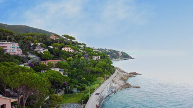 Panoramic aerial view of Varazze, Liguria region, province of Savona, Italy. A beautiful view of the coast surrounded by green hills l Beigua regional natural park, UNESCO geopark. 