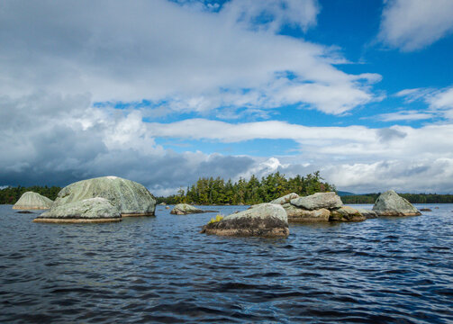 Millinocket Lake has unique boulders near Baxter State Park in Maine on a crisp fall morning