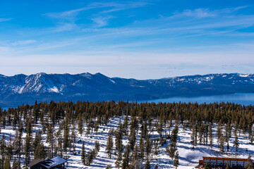 Photo of Lake Tahoe on a sunny winter day, with vivid blue skies.