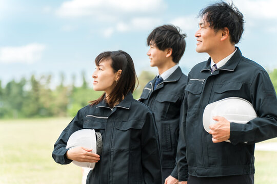 Male and female workers in work clothes (construction industry, agriculture, farming, transportation, logistics)