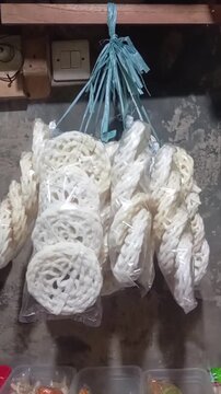 Traditional Indonesian Fried Crackers Hanging in Plastic Packaging