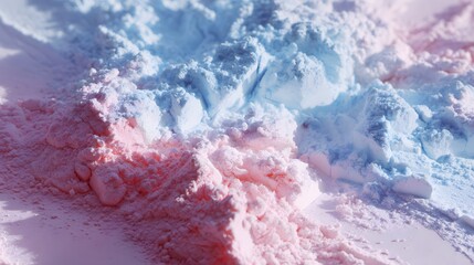 Obraz premium Abstract background of colorful powder in pastel pink and blue hues.