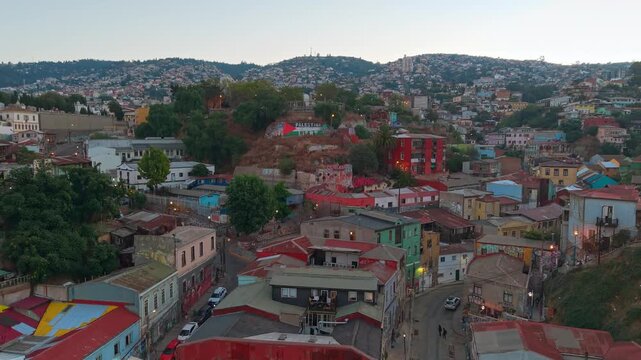 Aerial view of Cerro Carcel on a sunny day in the city of Valpara&iacute;so, with the city lit up in the background at sunset, Chile