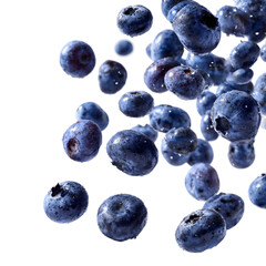 Falling blueberries on a white background.
