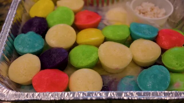 Enjoy puto from the Philippines made from rice flour and served with grated coconut in a local kitchen