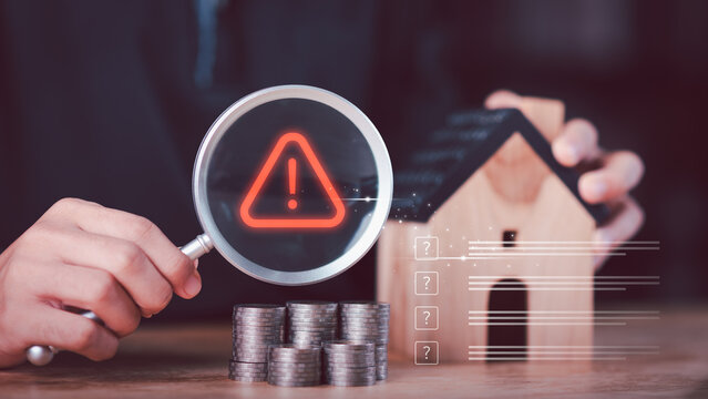 Financial analyst evaluating mortgage risk and housing uncertainty with warning symbol, Business of interest rate volatility, loan risk management, financial caution, real estate market analysis