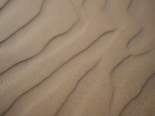 Sand dunes with natural wave patterns in desert landscape