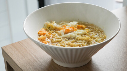 Mie Rebus, boiled instant noodle with chilli powder and egg