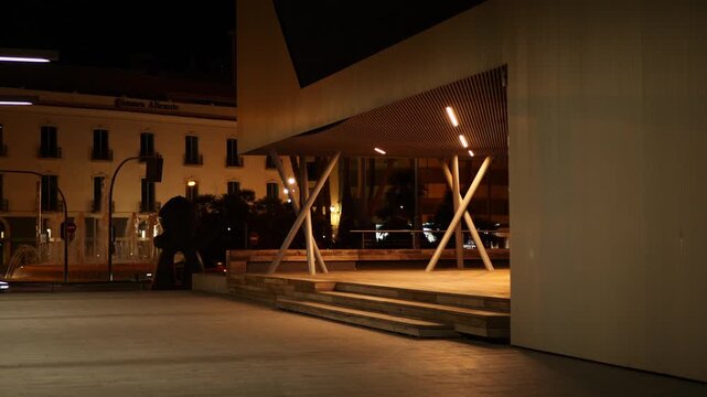 The entrance to the modern tourist office, at night. Alicante, Spain.