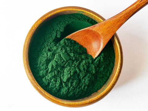 Organic Spirulina Powder in Wooden Bowl