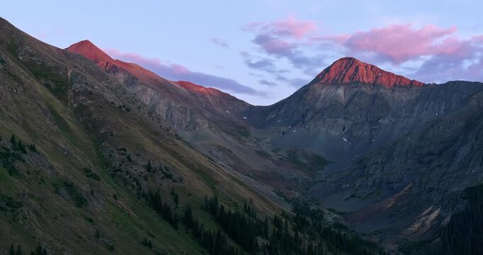 Wide aerial of mountain cirque and steep slopes overlooking American Basin at twilight, San Juans, Colorado USA