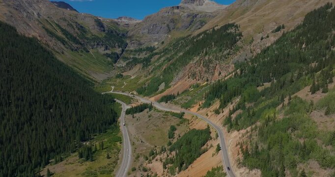 High elevation roadway crossing open mountain slopes in the Colorado San Juans, Million Dollay Highway Colorado USA