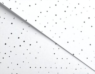 Close-up of white paper with tiny black dot pattern, angled across, creating a diagonal and visual separation
