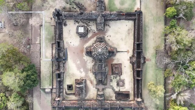 Cinematic drone pedestal shot of Phanom Rung (Phnom Rung) temple at  golden hour, ancient Khmer architecture in sunset lightning.