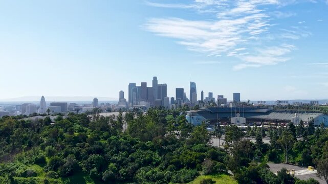 Dodger Stadium with a hazy smog covered Los Angeles skyline as a backdrop