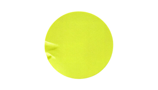 Blank green round adhesive paper sticker label isolated on white background