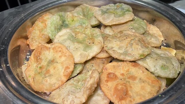 Crispy, golden-fried Indian peas (kochuri) stuffed with a savoury spiced green pea filling, served as a traditional breakfast or festive wedding appetiser.