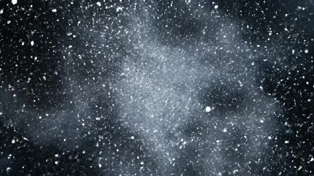 A shiny llic letter S breaks apart into sparkling particles.