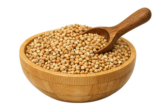 Buckwheat groats filling a wooden bowl, a small wooden scoop placed inside. Fresh healthy food for a vegan diet. Transparent background
