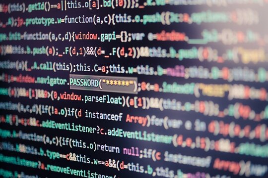 Close-up of colorful JavaScript source code with highlighted password variable, emphasizing cybersecurity, data protection, and secure programming practices

