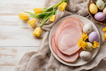Beautifully arranged ham slices on a plate, surrounded by yellow flowers and pastel easter eggs Generative AI
