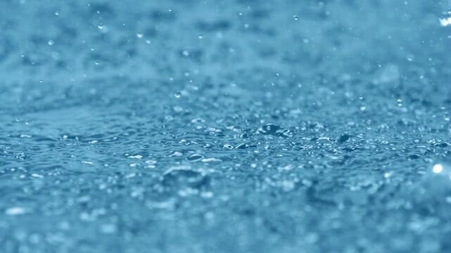 Slow Motion Rain Drops Falling - Water drops on blue background