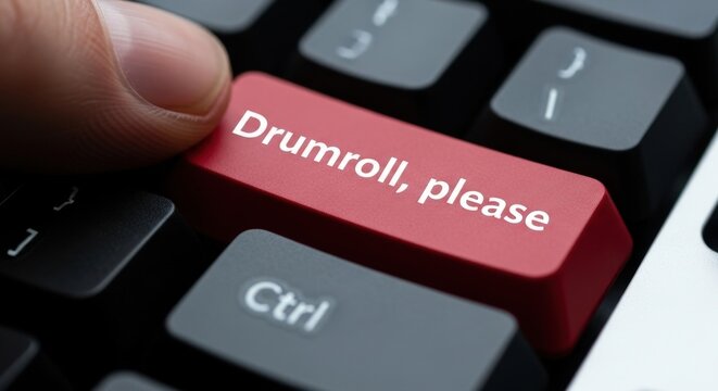 Finger Pressing Red Drumroll, please Button on Computer Keyboard