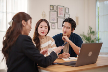 Asian couple consulting insurance agent about life insurance plan