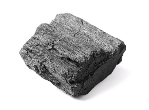 Piece of coal isolated on white background, closeup