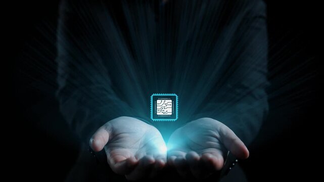A close-up view of hands holding a glowing microchip surrounded by digital circuitry, symbolizing the fusion of technology and human capability for a bright future. Qubit
