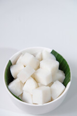 Sliced ketupat, Indonesian traditional rice cake, commonly served during Eid al-Fitr or lebaran. Isolated on white background