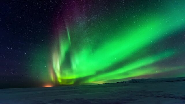 Aurora Borealis Milky Way Galaxy Reflections on Lake Simulated Nothern Lights, Time-lapse of ever-changing colorful aurora.
a dramatic night view with the bright green aurora borealis.