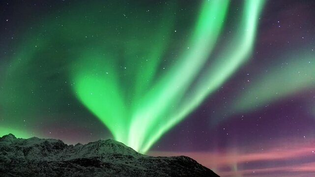 This animation of the northern lights was created in Adobe After Effects. Northern lights and the starry sky reflecting on the water.
Beautiful green and red aurora dancing over the hills.
