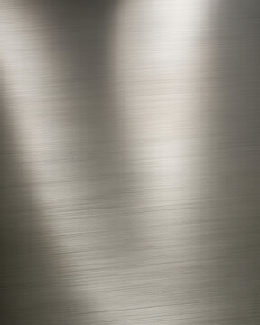 Close up of brushed metal surface with reflections