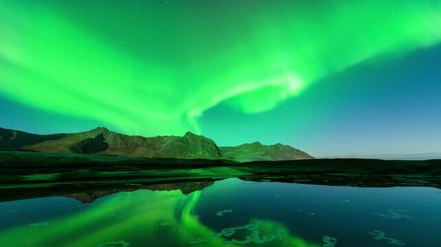 This animation of the northern lights was created in Adobe After Effects. Northern lights and the starry sky reflecting on the water.
Beautiful green and red aurora dancing over the hills.