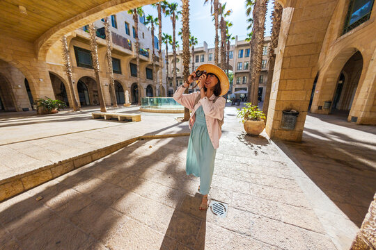 girl travels and takes pictures of sights with her camera. girl with camera. travel and content creation.