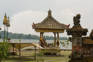 Golden Pavilion Shrine by Tranquil Lake &ndash; Serene Balinese Sacred Space