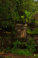 Ancient Mossy Guardian Statue in Mystical Balinese Jungle Temple &ndash; Serene Spiritual Charm