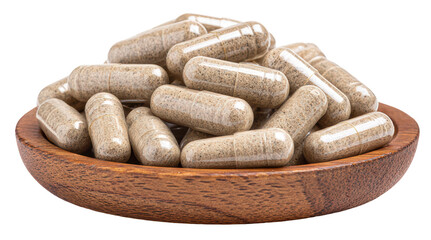 supplement capsules on a small wooden plate isolated on transparent background